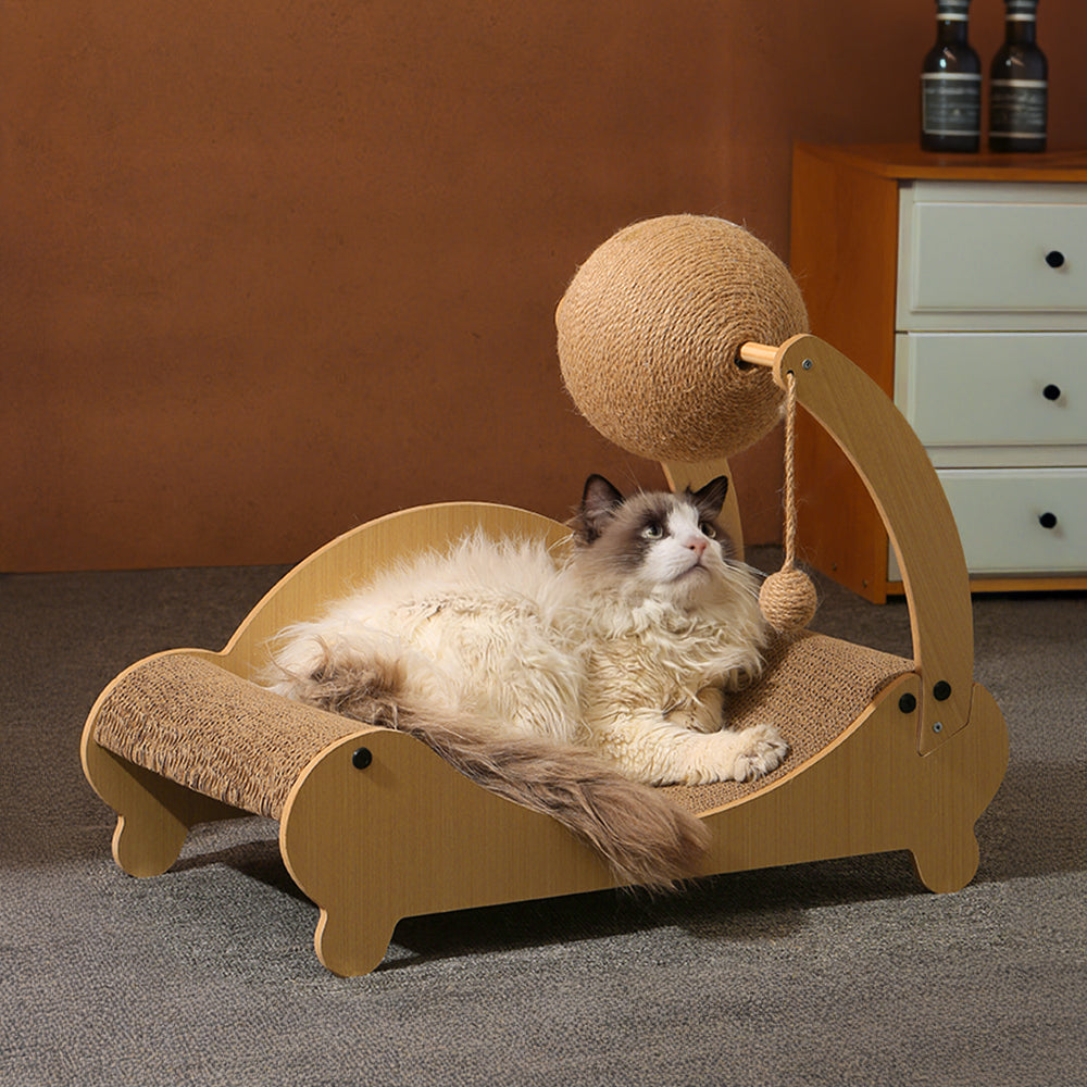 Cat lounging on a wooden pet bed with a ball toy above it, against a neutral background.